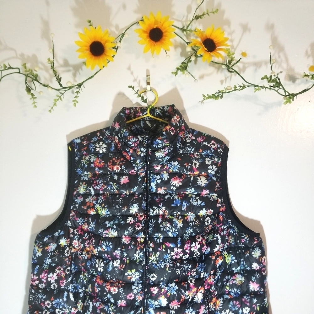 Woman within floral black vest